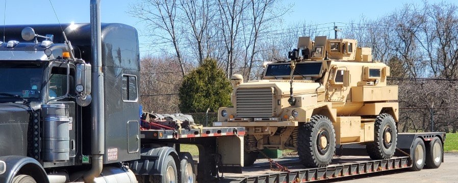 Military truck prepared for specialized equipment shipping